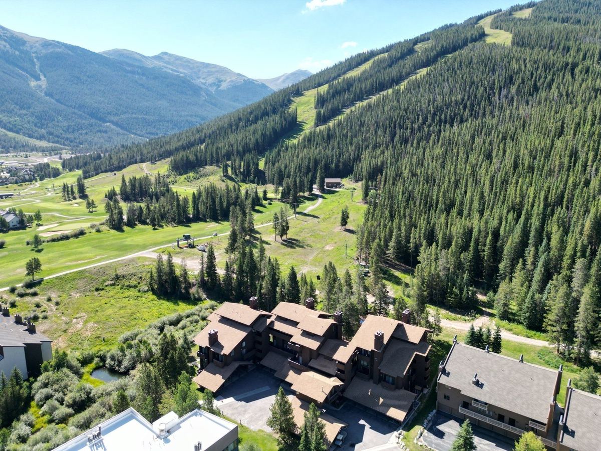 Aerial view of condo buildings at the base of Copper Mountain in summer