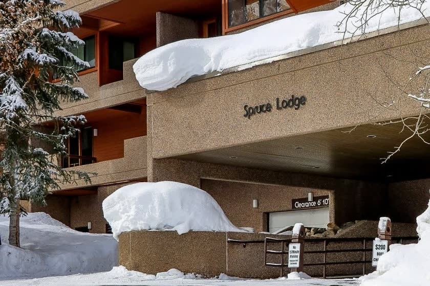 Spruce Lodge entrance under heavy snow