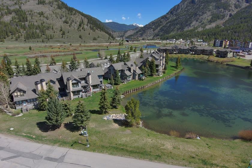 Woods and Legends townhomes beside a pond